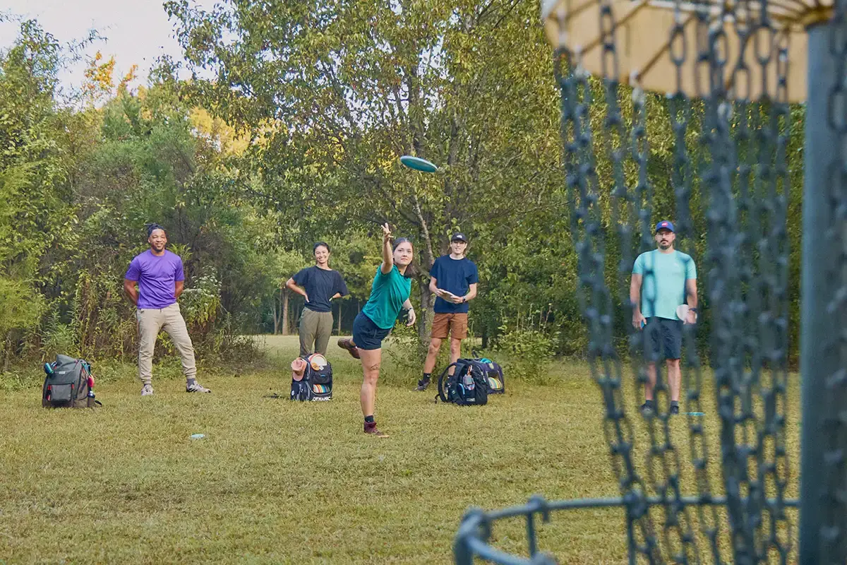 Disc golfers walking on a course